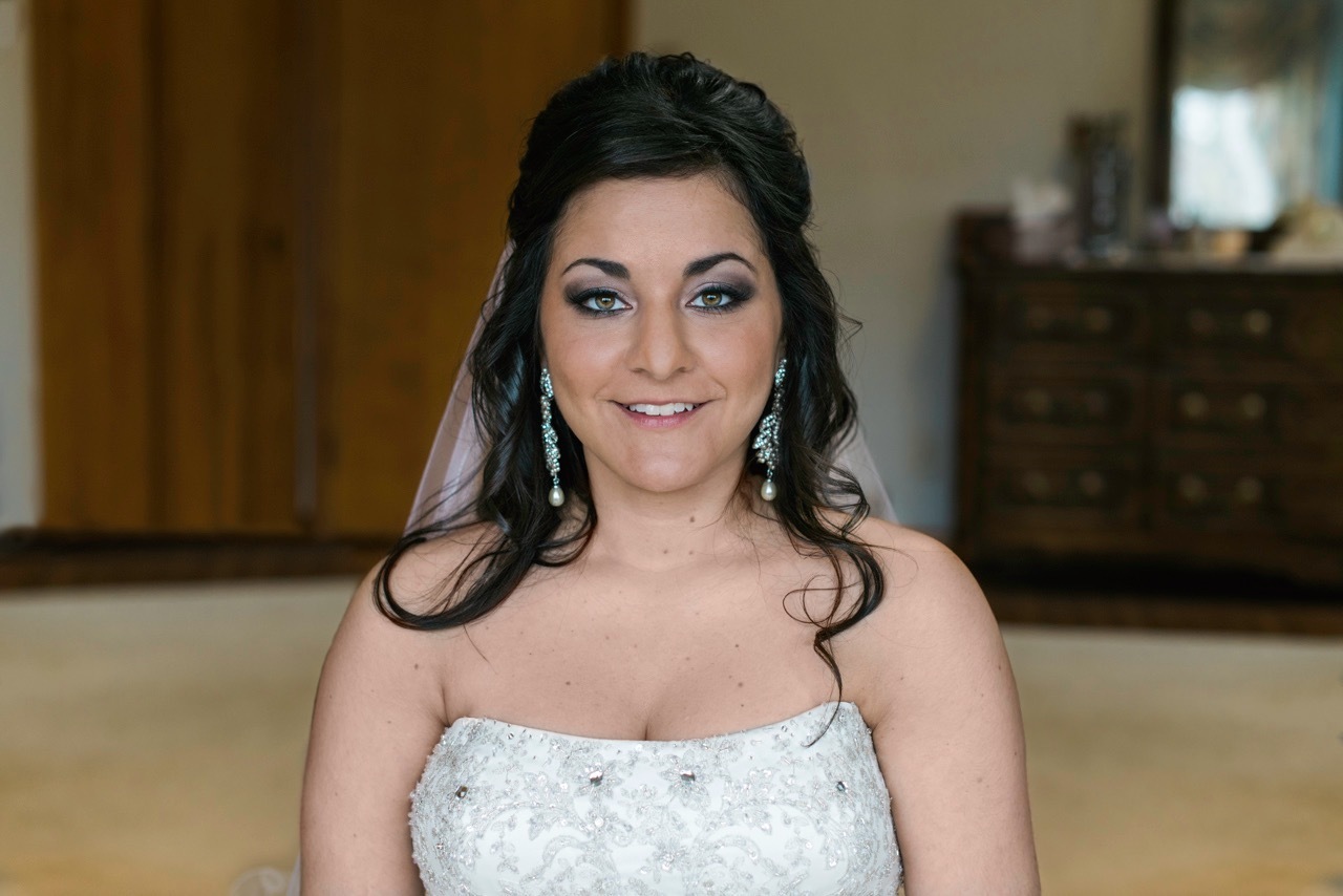Bride about to walk out and show everyone in her family how beautiful she looks
